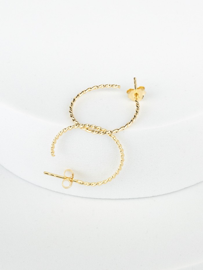 Twisted hoop earrings made from recycled gold